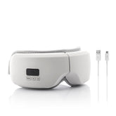 Eyesky-Massagebrille mit USB-C-Ladekabel auf weißem Hintergrund